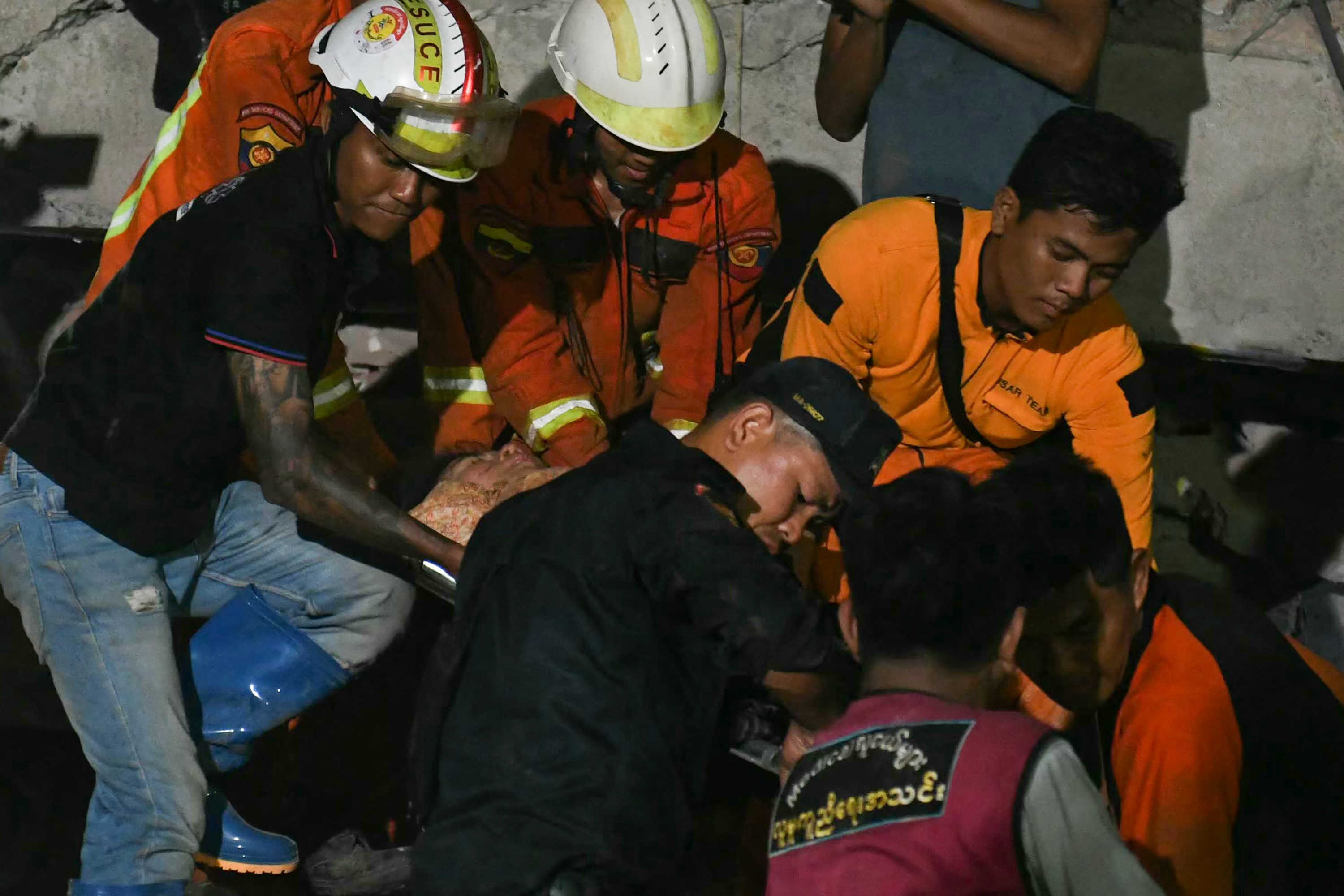 Phyu Lay Khaing is rescued from the rubble of the collapsed Sky Villa Condominium apartment building