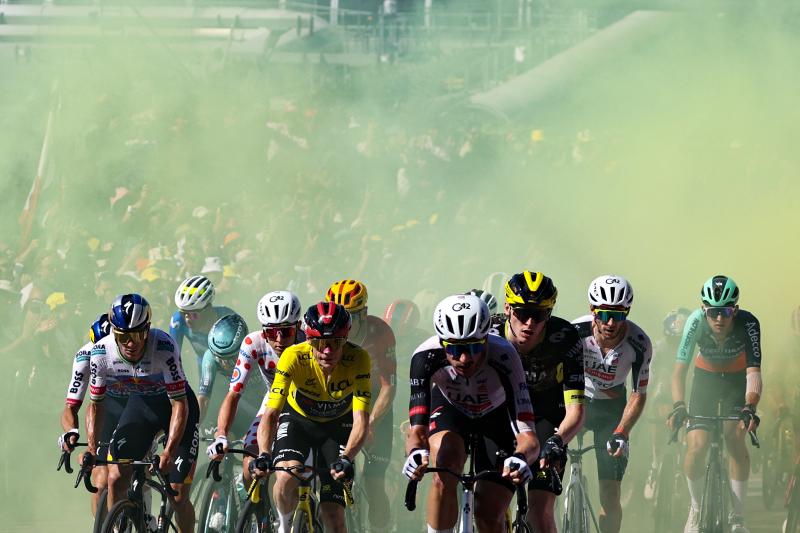 Red Bull - BORA - hansgrohe team's Belgian rider Remco Evenepoel (L), UAE Team Emirates - XRG's Slovenian rider Tadej Pogacar wearing the climber's dotted jersey 
