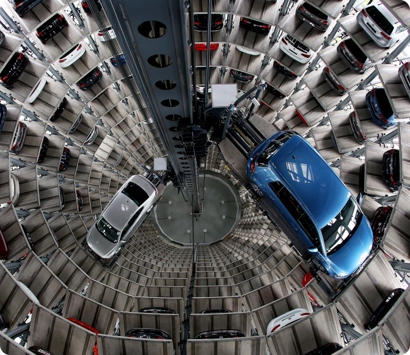 A new e-Golf vehicle (R) and a Passat (L) of German car maker Volkswagen